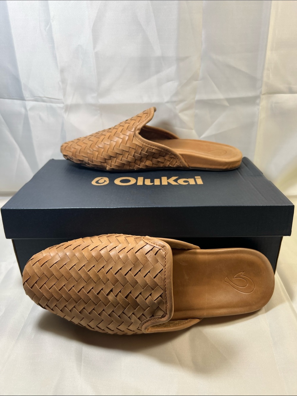 OluKai Brown Slip-On Flats with Red and Black Sole Detail